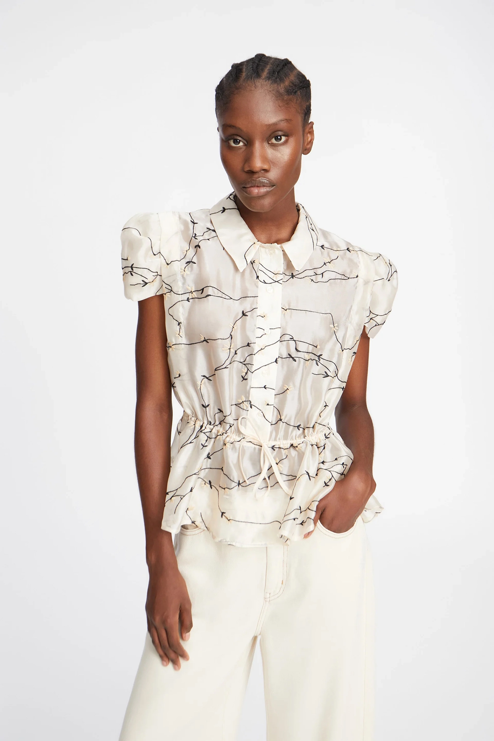 Dames blouse mouwloos ecru