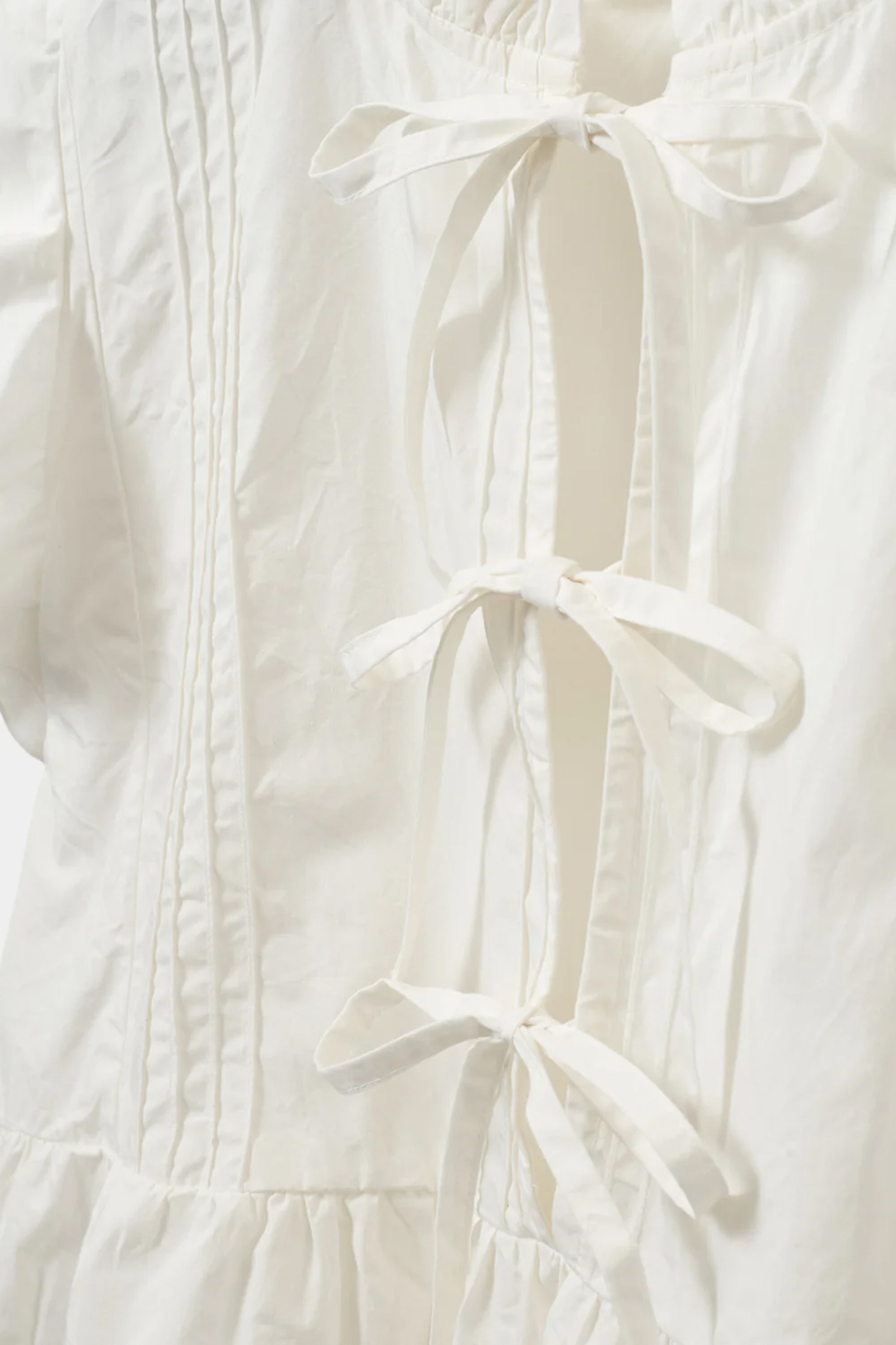 Meisjes blouse mouwloos ecru